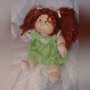 This is a red hair cabbage patch kid